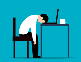Stressed employee with head down on desk, cartoon